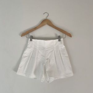 White pleated shorts